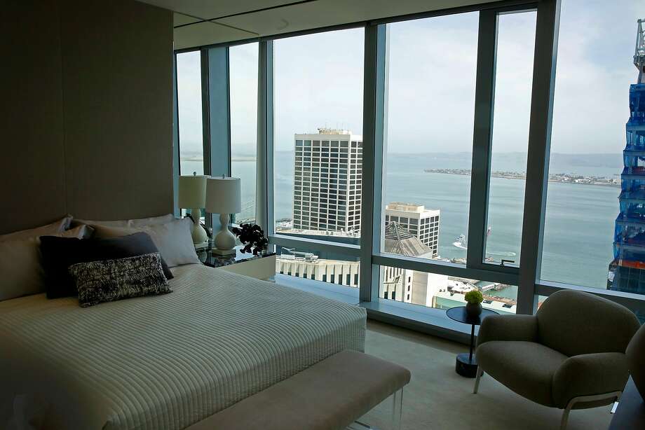 A bedroom in the model home at the 181 Fremont Residences has sweeping views of the bay. Photo: Michael Macor / The Chronicle